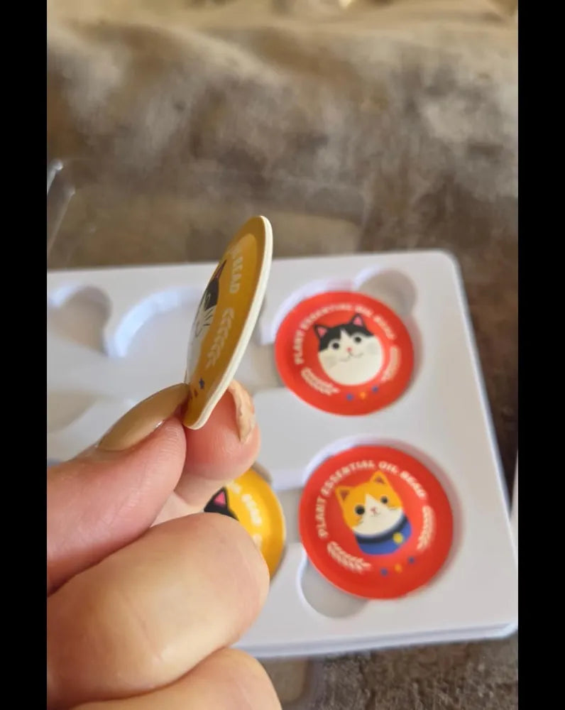 Calming sticker held beside its tray